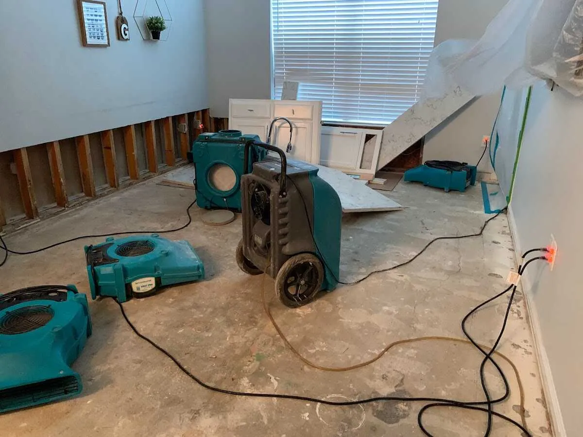 Dehumidifier in flood-cut room for Water Damage Restoration in Bloomington